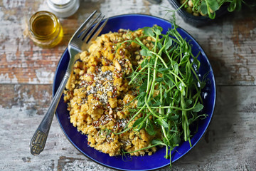 Selective focus. Plate with lentils and micro greens. Vegan food. Diet concept.