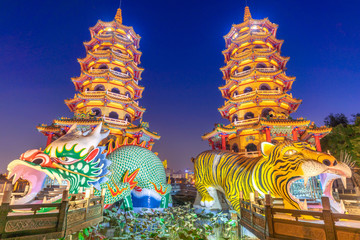 Dragon and the tiger pagoda at the lotus pond at night.