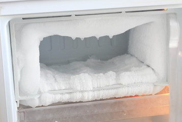 Ice full in empty freezer of a refrigerator makes refrigerator work harder and broken.