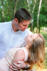 Fototapeta premium Young woman and guy looking to the eyes of each other with love and confidence