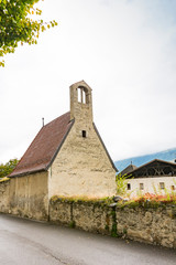 Fototapeta premium small church in Schlanders, Austria_