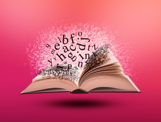 Open Book with Letters on Pink Background. Studying and Learning Concept. Creativity an Reading Symbol.