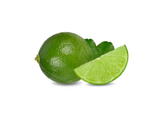 whole and sliced ripe green lime with leaves on white background