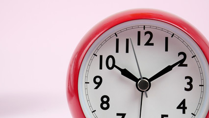 Red Alarm clock  beginning of time 10.10 am or pm, on white background, Copy space for your text, Time concept.