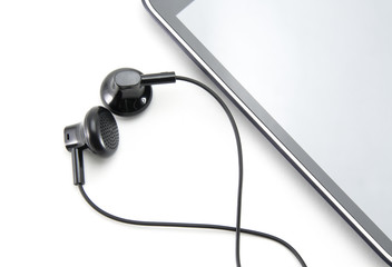 Black smartphone with a white border (stripe) in a circle. Gray blank screen. and two black small earbuds from the headset for insertion into the ear. Part of the phone on a white isolated background