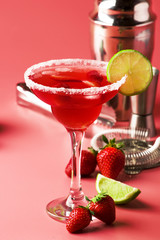 Strawberry margarita alcoholic cocktail with tequila, liqueur, berries, lime juice, sugar and ice,...