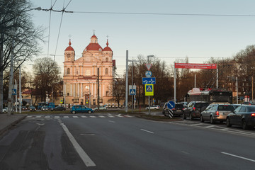 Fototapeta na wymiar The Church of St. Peter and St. Paul in Vilnius Lithuania and traffic time