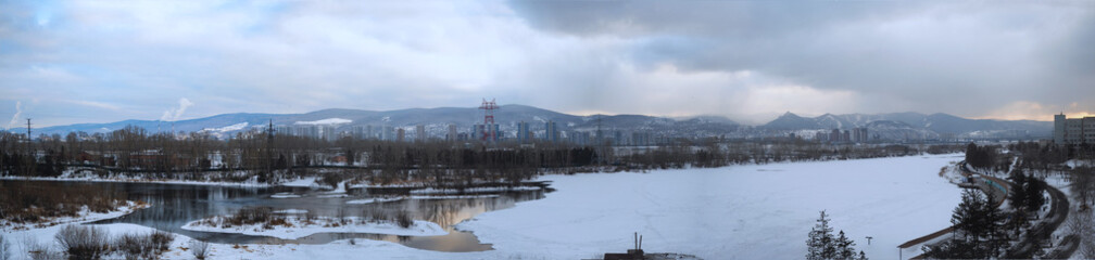 panorama of the winter city landscape, view of the river and the embankment