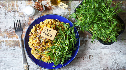 Selective focus. Plate with lentils and micro greens and cbd oil. Cannabis food concept. Vegan...