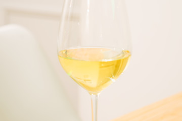Head of Wineglass with white wine