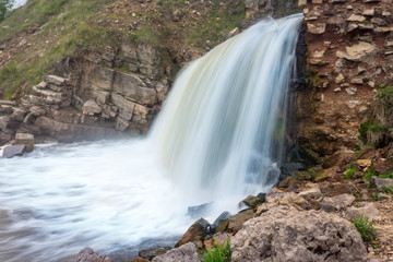 Artificial waterfall in the Kusie-Aleksandrovsky village takes. Perm region, Ural