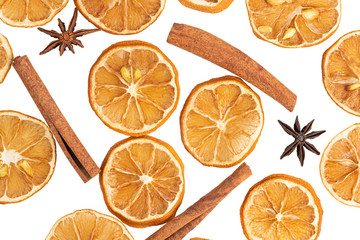Cinnamon sticks, slices of dried lemon, star anise isolated on white background. Top view