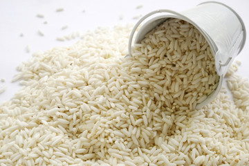 rice in a bowl and white background. rice seed