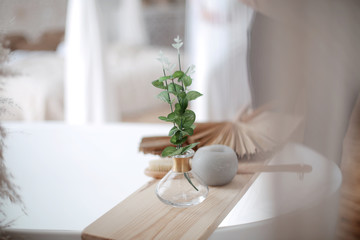 Adorable shabby chic bathroom interior in bright colors. gold plumbing. Home interior. Selective focus. table with a mirror and makeup