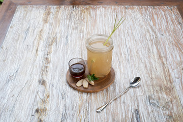 ginger tea in a glass jar with some syrup