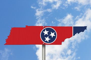 State of Tennessee road sign in the shape of the state map with the flag