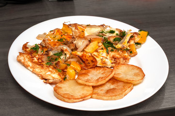 omelet with vegetables, fried potatoes. homemade food