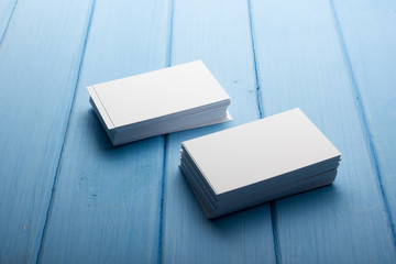 Business card blank on wooden background. Corporate Stationery, Branding Mock-up. Creative designer desk. Flat lay. Copy space for text