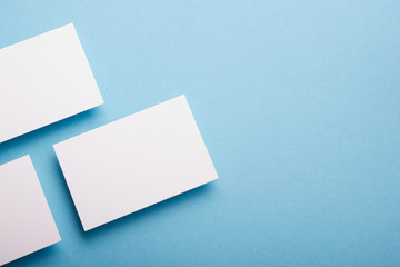 Business card blank on wooden background. Corporate Stationery, Branding Mock-up. Creative designer desk. Flat lay. Copy space for text