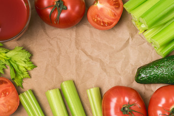 Background or Flat Lay with Glass of Tasty and Healthy Tomatoes and Celery Juice Raw Tomatoes Celery and Avocado on Green Background Top View Flat Lay Copy Space