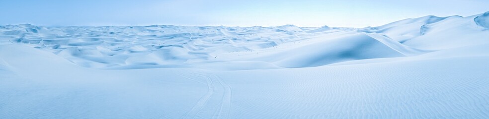 Big snow and ice dunes panorama with tire marks. Arctic Snowball Earth. - 326054981