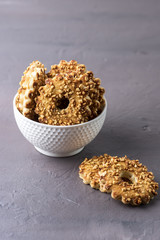 Two White Bowls of Tasty Chips Cookies with Nuts Gray Background Dessert Vertical