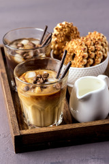 Two Glass of Tasty Cold Coffee on Wooden Tray Black Coffee and Coffee with Milk Refreshing Cold Summer Drink Vertical Bowl with Cookies