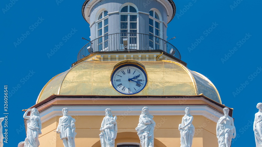 Wall mural upper part with clock of the tower of the admiralty building timelapse in st. petersburg, russia.