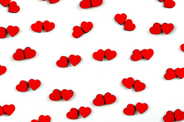 Pattern of a lot of small red hearts isolated on white background. Hearts are located by couples. Concept of love. Flat lay.