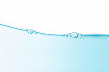 Air bubbles floating on wave. Water splash isolated on white background.