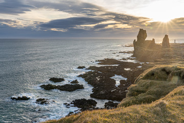 Volcanic rock  coast  Londrangar famous cliffs in west iceland with sun star beautiful landscape