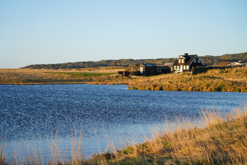 beautiful small black house with lake view and grass field in Arnarstapi, Iceland