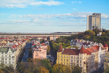 Autumn view of bridge and tall building in Prague from Vysehrad, Czech Republic
