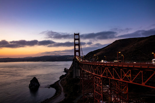 San Francisco California Red Bridge, Golden Gate during sunset in San Francisco Bay, cloudy sky and horizontal image