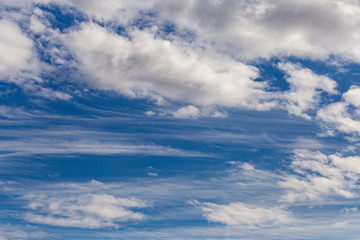 Beautiful white clouds on a blue sky background. Wallpaper sky clouds. Website template cloudscape.