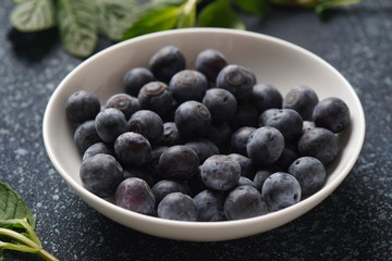 Blueberry antioxidant organic superfood in a bowl concept for healthy eating and nutrition. Close-up
