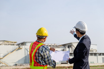 construction engineer standing in a conversation on the construction site