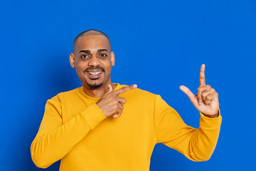Naklejka premium African guy with a yellow jersey