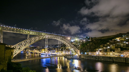 Fototapeta na wymiar Timelapse The Dom Luis I Bridge is a metal arch bridge that spans the Douro River between the cities of Porto and Vila Nova de Gaia, Portugal