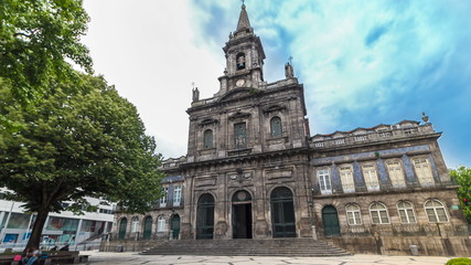 Fototapeta na wymiar The Trinity Church timelapse in Porto, Portugal. Porto is one of the most popular tourist destinations in Europe.