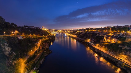 Day to Night view of the historic city of Porto, Portugal timelapse with the Dom Luiz bridge