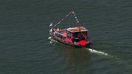 Passengers in a cruise on the Douro river in Tourist boat in Porto, Portugal timelapse