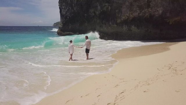 Young Romantic Couple Running Together Alone Empty Beach With Beautiful Blue Ocean On Paradise Island