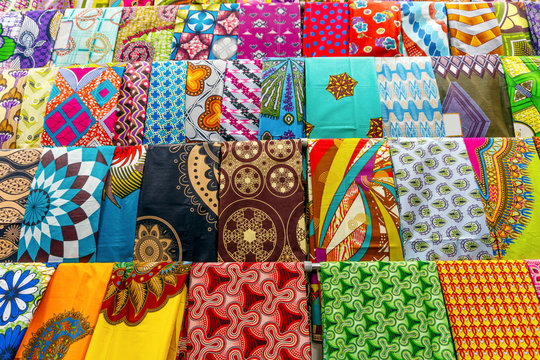 Plenty of colorful African fabrics in a rows