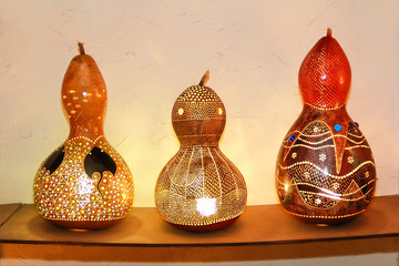 oriental traditional turkish dried pumpkin lamps with hole patterns and light bulbs
