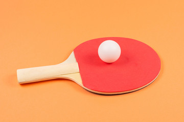 Pin pong on an orange background.