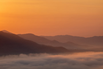 The sunrise with mountains and clouds