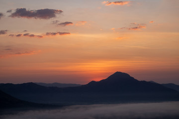 The sunrise with mountains and clouds