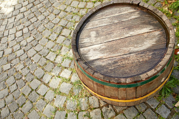 old wine barrel on the paving stones