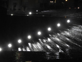 illuminated stairs at night during the rain